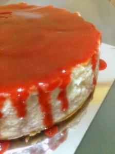 Strawberry Cheesecake dripping with strawberry sauce